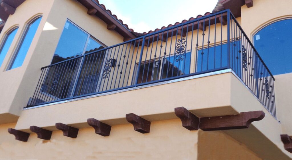 A second story balcony wrought iron railing.