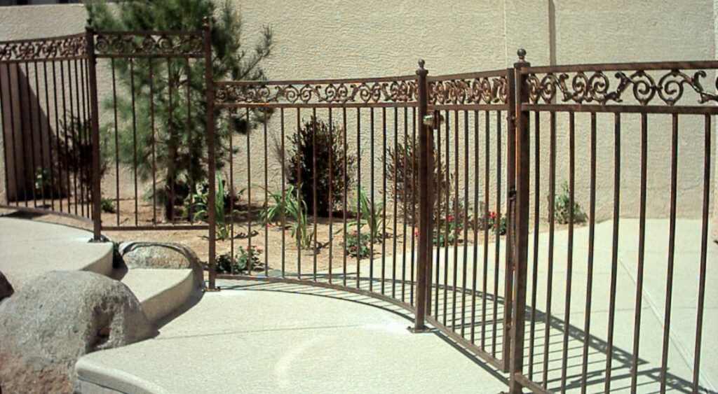 An inside look of wrought iron pool fencing.