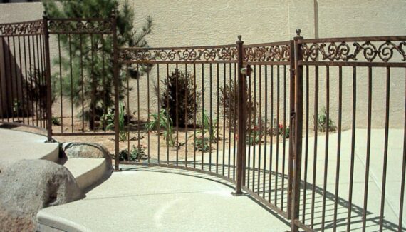 An inside look of wrought iron pool fencing.