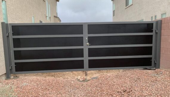 A wrought iron gate guarding a business property.